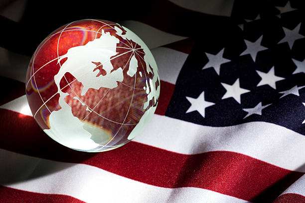 Image of the American flag with the earth superimposed on it stock photo