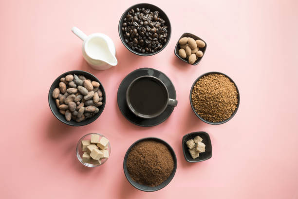 istock Concept of coffee, cacao beans and different sugar on pink. 1136838595