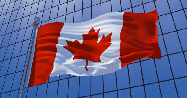 istock Canadian flag on skyscraper building background. 3d illustration 1136840059
