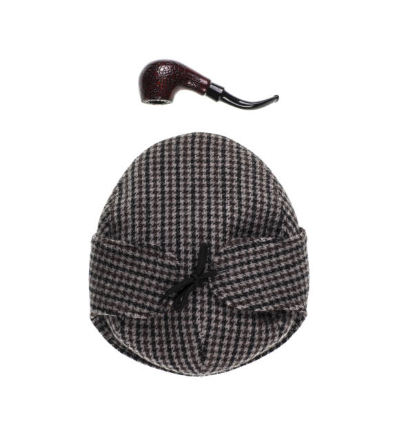 istock vintage wool cap and smoking pipe on white background,Sherlock Holmes classic attributes 1136840619