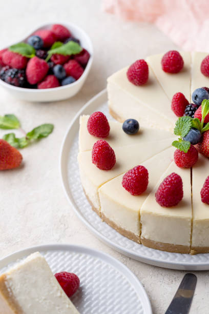 istock Piece of birthday cake with whole cake on white table 1136842067