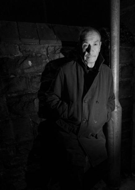 istock mature man in dark alley 1136842825