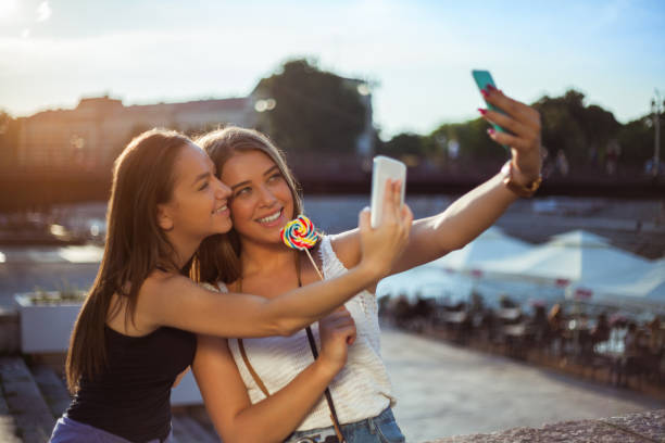 istock Best friends taking selfie together 1136846191