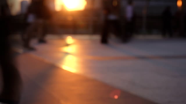 HD SLOW MOTION: Silhouettes of Pedestrians Commuting in City.