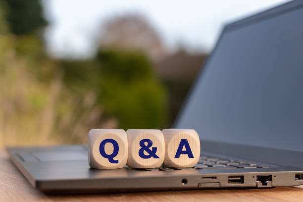istock Symbol for Questions and Answers. Cubes placed on a notebook with the letters 