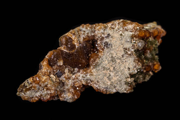 istock macro mineral stone Grossular, Garnet, Epidote on a black background 1136847862
