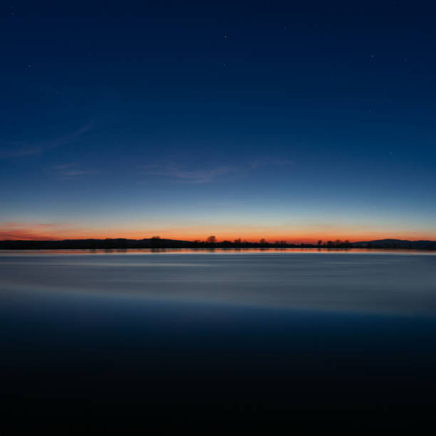 istock sunrise sky over the water 1136848470