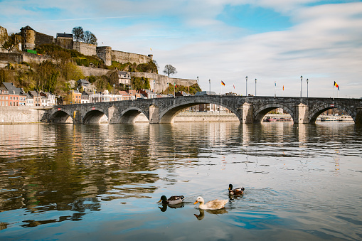 Classic view of the historic town of Namur with famous Old Bridge crossing scenic River Meuse in summer, province of Namur, Wallonia, Belgium