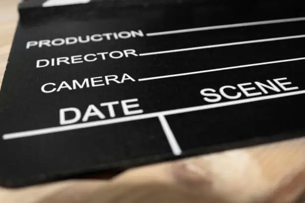 Clapper board on a wood surface, Selective focus, Cinema and videomaking concept