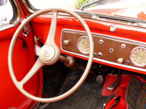 istock Dashboard with tools and steering wheel of a vintage car. 1136849714