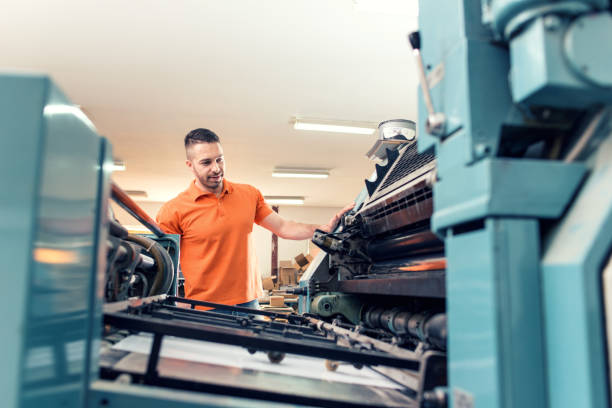 Workers in a printing factory stock photo