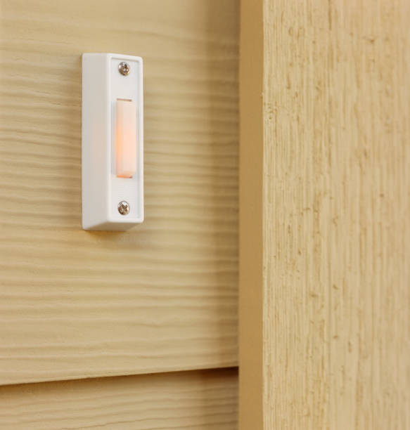istock Doorbell button on house home exterior front door details 1136850462
