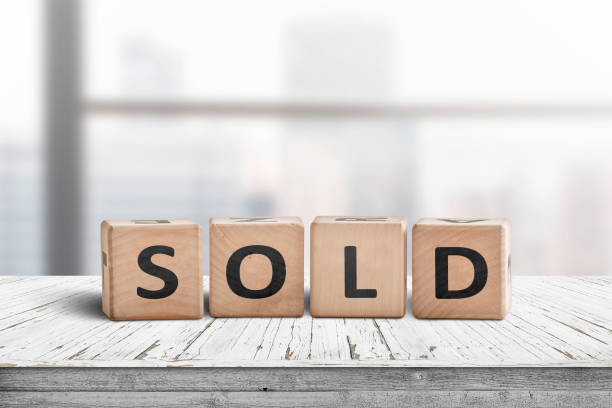 istock Sold sign on a wooden table 1136852287