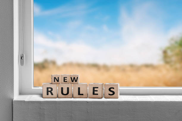 New rules sign in a window with a view to fields stock photo