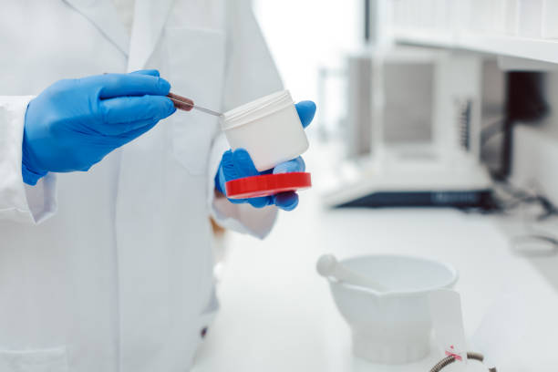 istock Pharmacist mixing drug on order in laboratory 1136852666