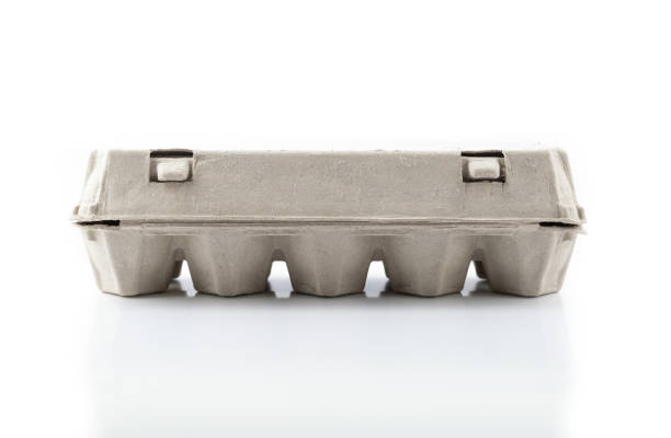 istock Egg carton for ten eggs, closed, isolated on white 1136852693