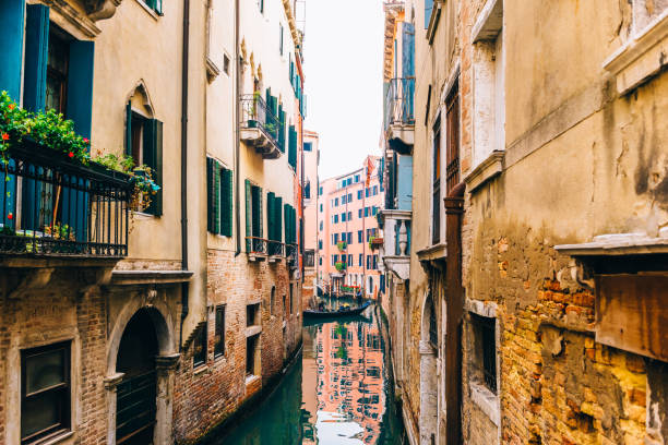 istock narrow canals of Venice Italy 1136854433