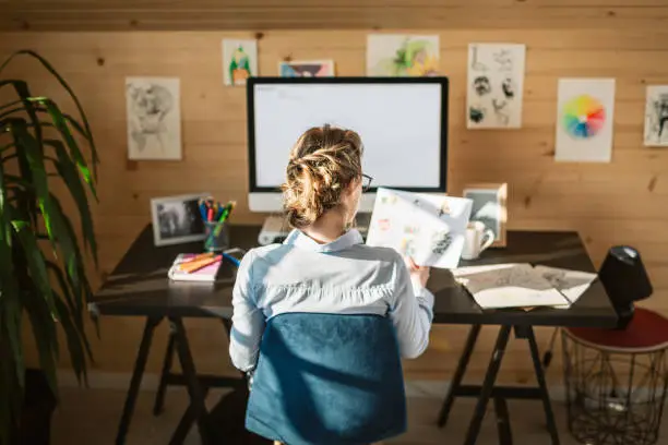 Female Graphic Designer Working In Creative Office Studio