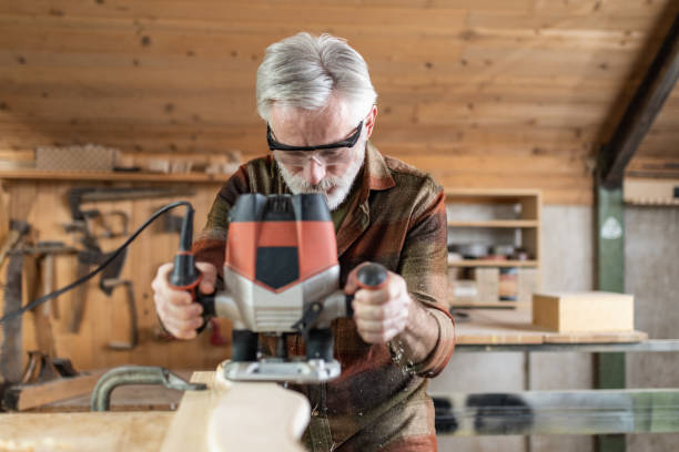 istock Senior Carpenter Working In His Old-Fashion Workshop 1136856723
