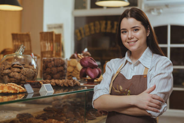 istock Lovely female baker at her shop 1136856949