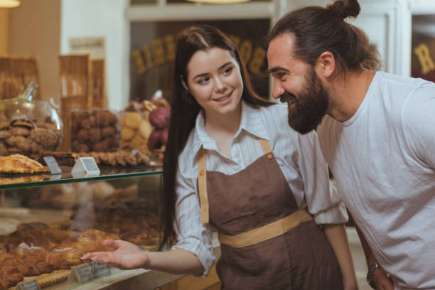 istock Lovely female baker at her shop 1136856977