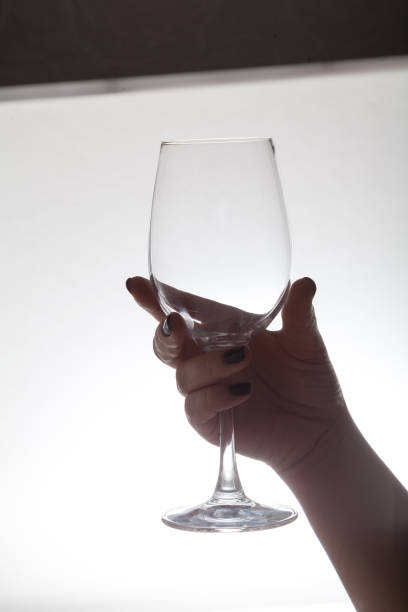 istock Hand holding  glass wine glass 1136857278