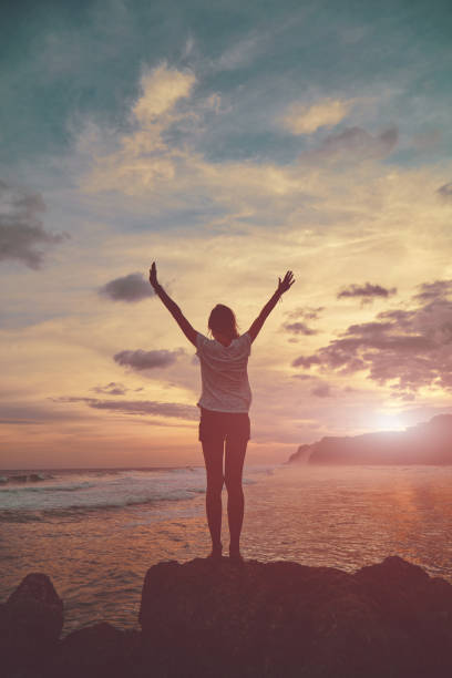istock Attractive woman enjoying on the beach. 1136858247