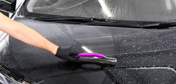 istock A man cleaning car with plastic sponge. Car detailing or valeting concept. Selective focus. Car detailing. Cleaning with sponge and cloth. Worker cleaning. Car wash concept solution to clean 1136858285