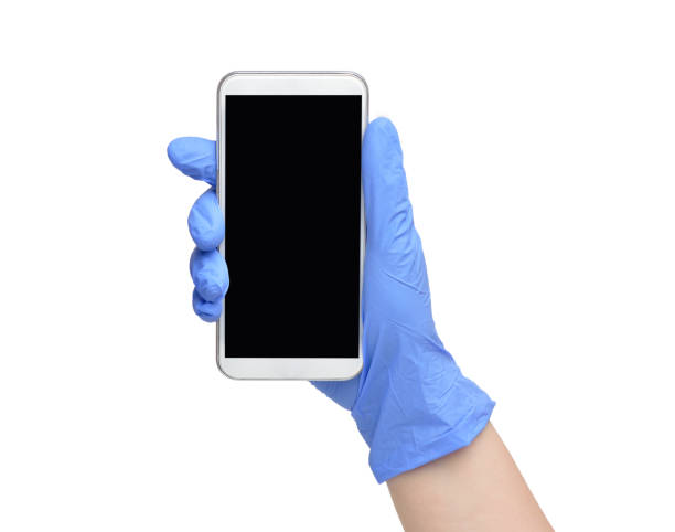 con il telefono collegato - glove surgical glove human hand protective glove foto e immagini stock