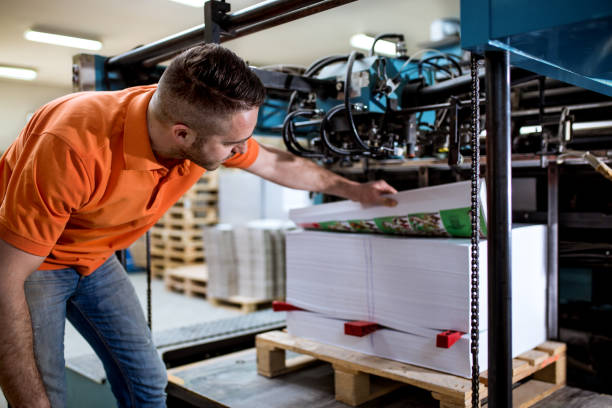 istock Man working in printing factory 1136860026