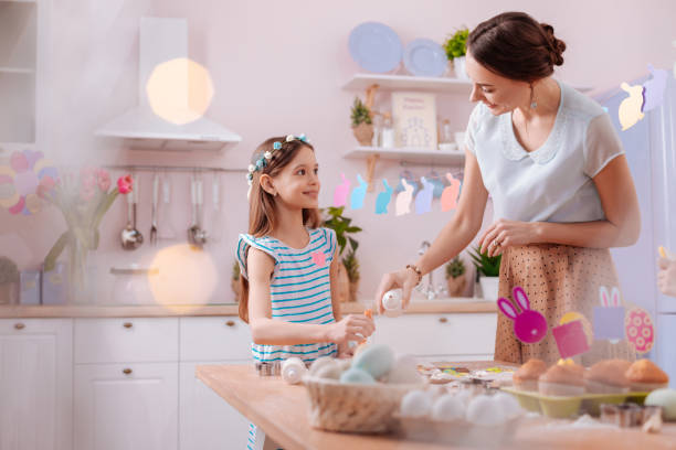 istock Charming young mother listening to her daughter 1136860502