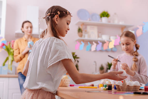 istock Concentrated little female being deep in thoughts 1136860584
