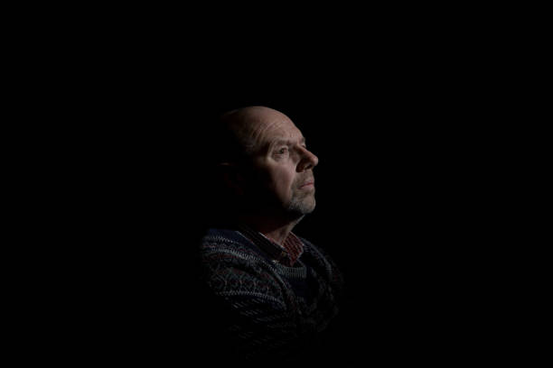 istock senior man in contemplative mood 1136860658