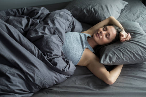 Woman sleeping in a bed