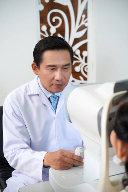 istock Doctor examining patient's eye vision 1136861789
