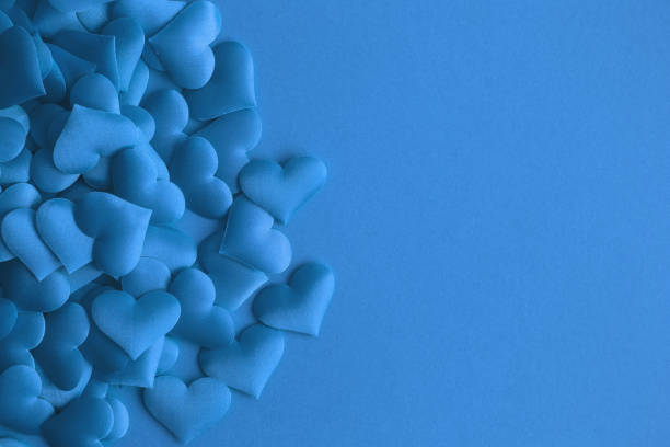 istock Love concept made of small hearts abstract on blue. 1136862723
