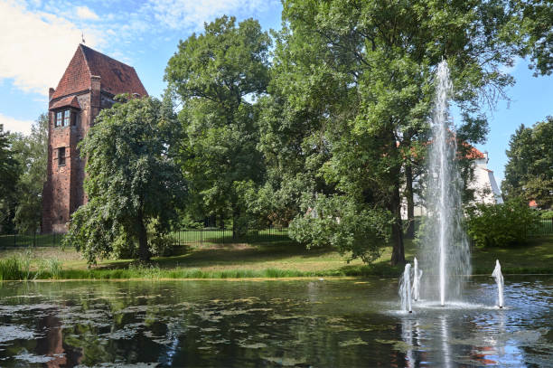 Pond, fountain and medieval bastion of bricks in Szamotuly in Poland