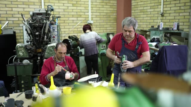 People working hard in shoe factory