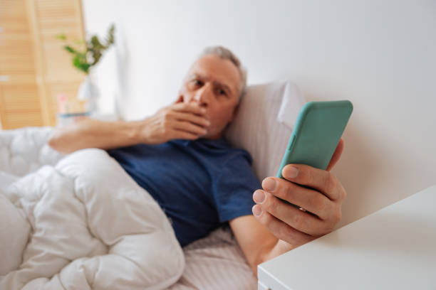 istock Dark-eyed businessman feeling emotional after seeing e-mail 1136868037