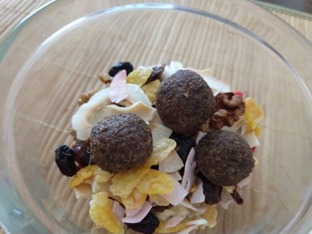 istock Bowl with nuts and dried fruits and raw balls. 1136868982