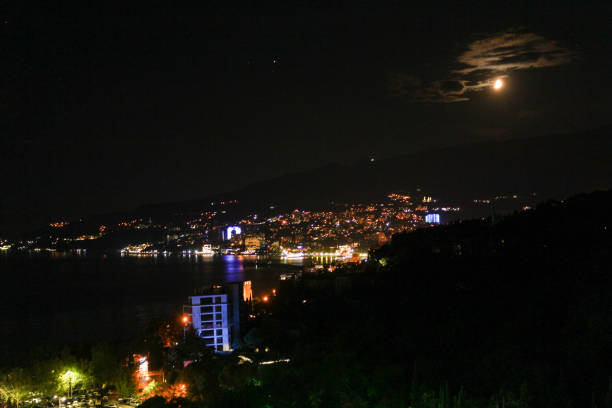 istock Moonlit night over the resort town. 1136870050