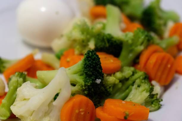 istock Cooked colorful vegetables with eggs on the plate. 1136870128
