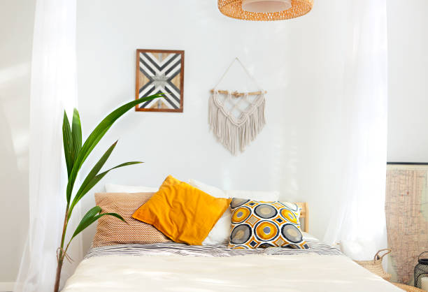 istock White and beige bedroom in boho style with macrame 1136871775
