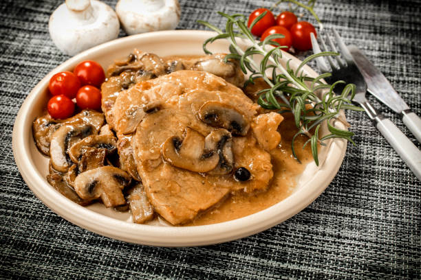 istock Braised pork chop with mushrooms. 1136871848