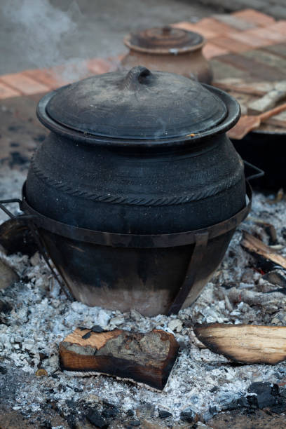 istock Cooked meal on fire in clay pot 1136872316