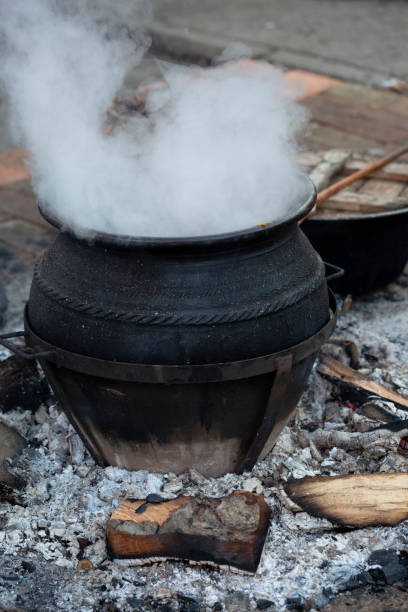 istock Cooked meal on fire in clay pot 1136872355