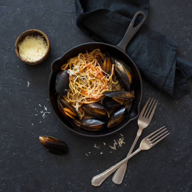 istock Spaghetti , mussels, and parmesan cheese 1136873598