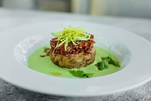 istock Meat dish with rice, onions slices, greens and sauce 1136874877