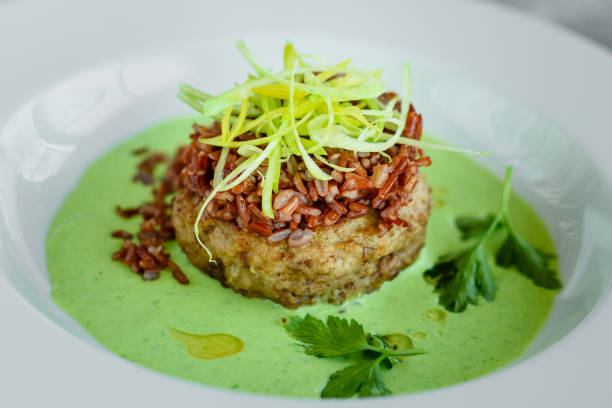 istock Meat dish with rice, onions slices, greens and sauce 1136874880