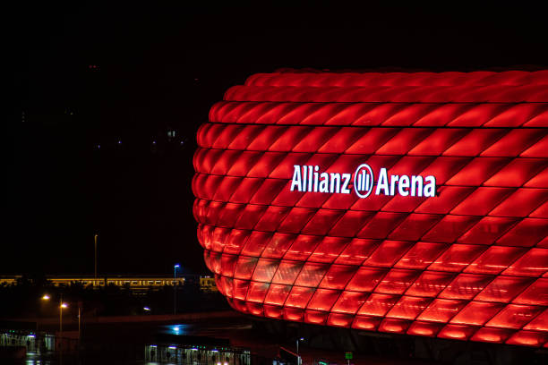 The soccer stadium (Allianz Arena - in english alliance arena) in munich of the team FC Bayern Munich at night in red colors Munich, germany - Sep 07 2018: The soccer stadium (Allianz Arena - in english alliance arena) in munich of the team FC Bayern Munich at night in red colors allianz arena stock pictures, royalty-free photos & images